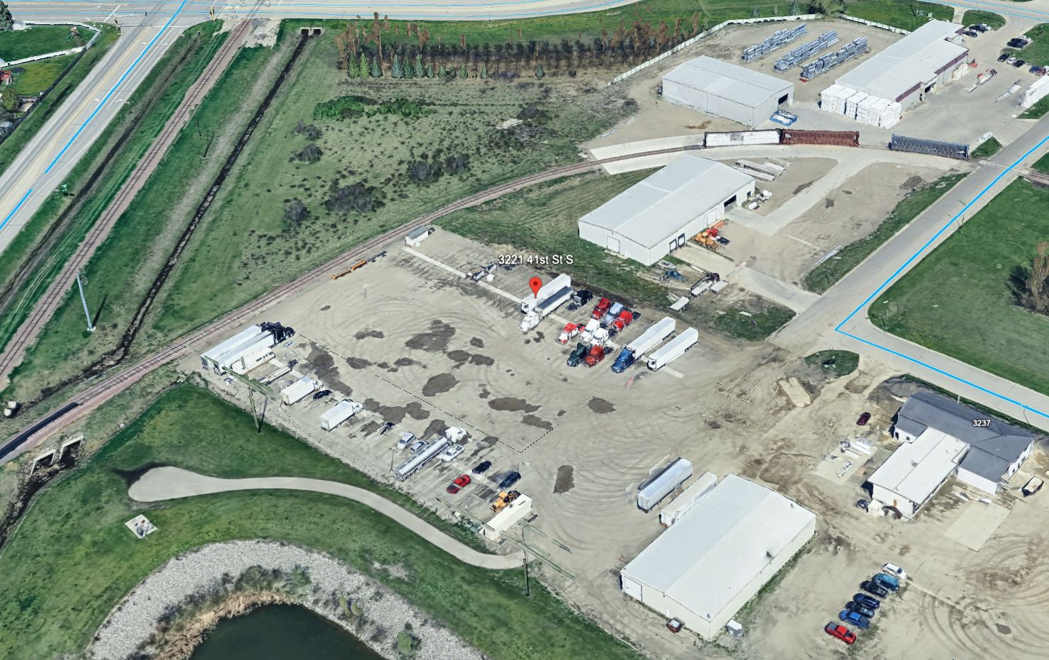 Aerial view of LT Parking lot showing semi trucks parked in dedicated spaces with I-94 access